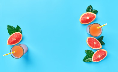 Fresh  grapefruit juice  on a blue background,top view