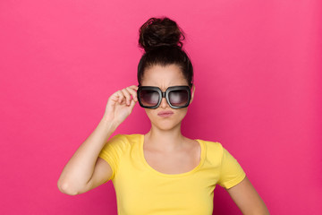 Grmacing Young Woman In Big Sunglasses