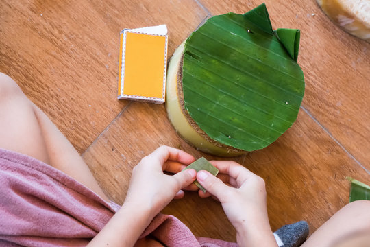 Hands Children make krathong form nature object for Loy Krathong festival in november