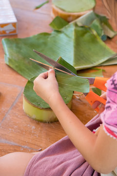 Hands Children make krathong form nature object for Loy Krathong festival in november