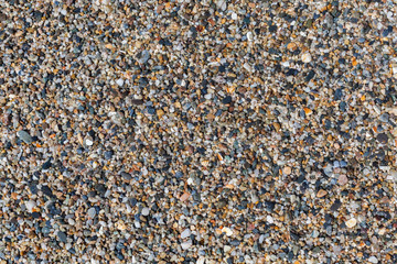 Colored stones and sea shells on the beach