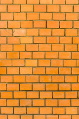 Mauer aus hellem, roten Ziegelstein in Nahaufnahme, Wall of bright, red brick in closeup
