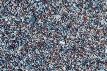 Colored stones and sea shells on the beach