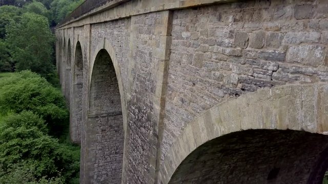 Drone rising to reveal a canal boat on Chirk Aqueduct on the English and Welsh border - Long Version