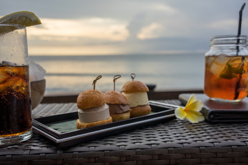 drinks and dessert with ocean view, holiday mood