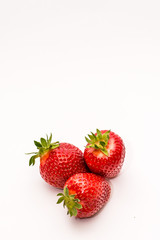 Strawberry on a white surface