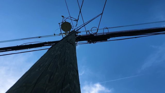 looking up at a telephone pole