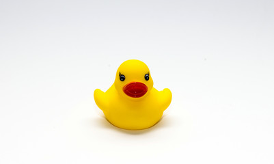 Cute yellow rubber duck isolated over white background
