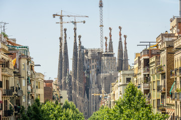 Barcelona, Spain  July, 2017: Cathedral of La Sagrada Familia from the Hospital of Sant Pau. It is...