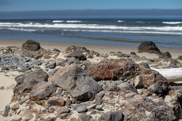 an assortment of rocks on the beach at Cape Perpetua Scenic Area in Central Oregon Pacific Northwest USA near Yachats