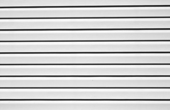 Plastic siding surface in black and white.