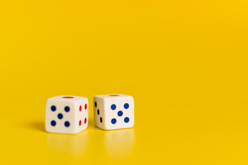 white dice on yellow background