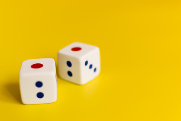 white dice on yellow background