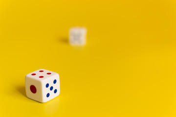 white dice on yellow background