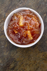 orange marmalade in white dish