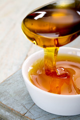 refined golden sugar syrup in dish