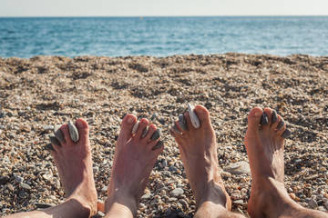 Colored stones and sea shells on the beach