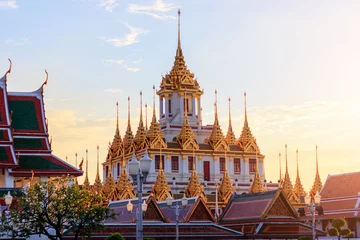 Foto op Canvas Beautiful sky and Wat Ratchanatdaram Temple in Bangkok, Thailand. Thai architecture: Wat Ratchanadda, Loha Prasat and Traditional Thai pavilion is among the best of Thailand's landmarks. © nottsutthipong