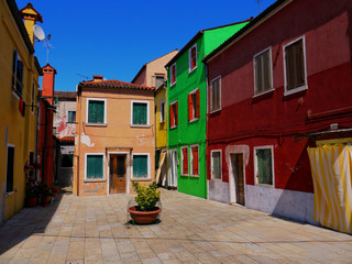 Fototapeta na wymiar The houses painted in brilliant pastel shades at Burano Italy