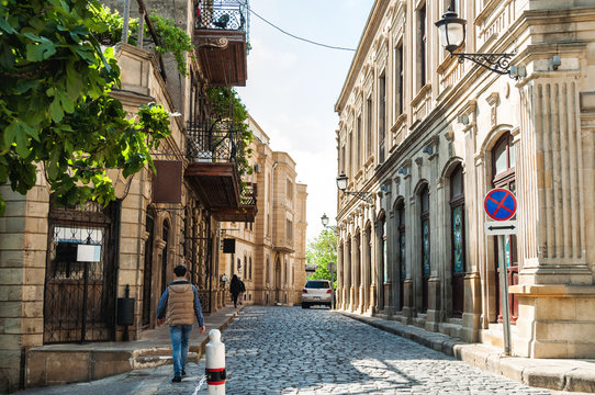 Old city Baku. Ancient city buildings. Vintage stone street.