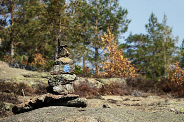 Stack of stones marking hiking trail on mountain. Skule mountain close to Docksta in northern Sweden.