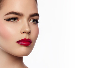 Beauty and fashion of the woman with chubby red lips and shooters of a pencil in the eyes. Magnificent eyelashes, eyebrow mascara and red lipstick. Beautiful long neck, pure leather