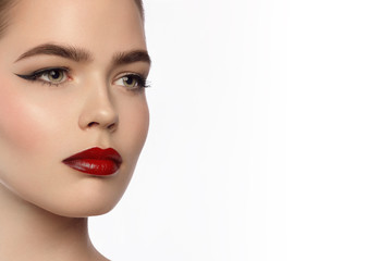 Beauty and fashion of the woman with chubby red lips and shooters of a pencil in the eyes. Magnificent eyelashes, eyebrow mascara and claret lipstick. Beautiful long neck, pure leather