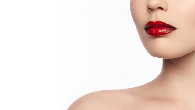 Close-up of a woman's lips with a fashionable make-up in the style of ombre and red lipstick. Long neck and clean skin. Cosmetology, injections, cosmetics, make-up courses, lip augmentation