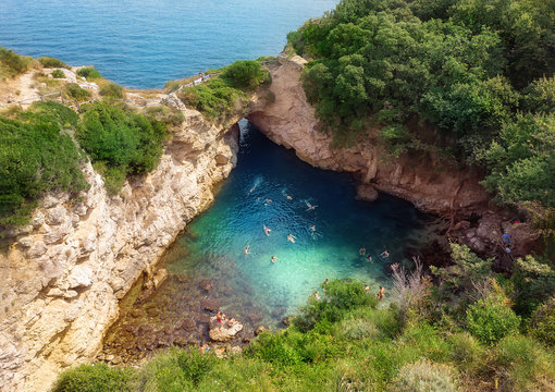 People Swimming In Regina Giovanna Queen's Bath Near Sorrento. Italy