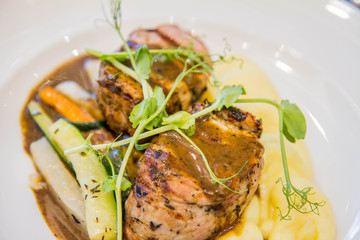 Pork tenderloin with mashed potatoes and steamed vegetables