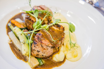 Pork tenderloin with mashed potatoes and steamed vegetables