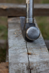 Claw hammer on a wooden beam