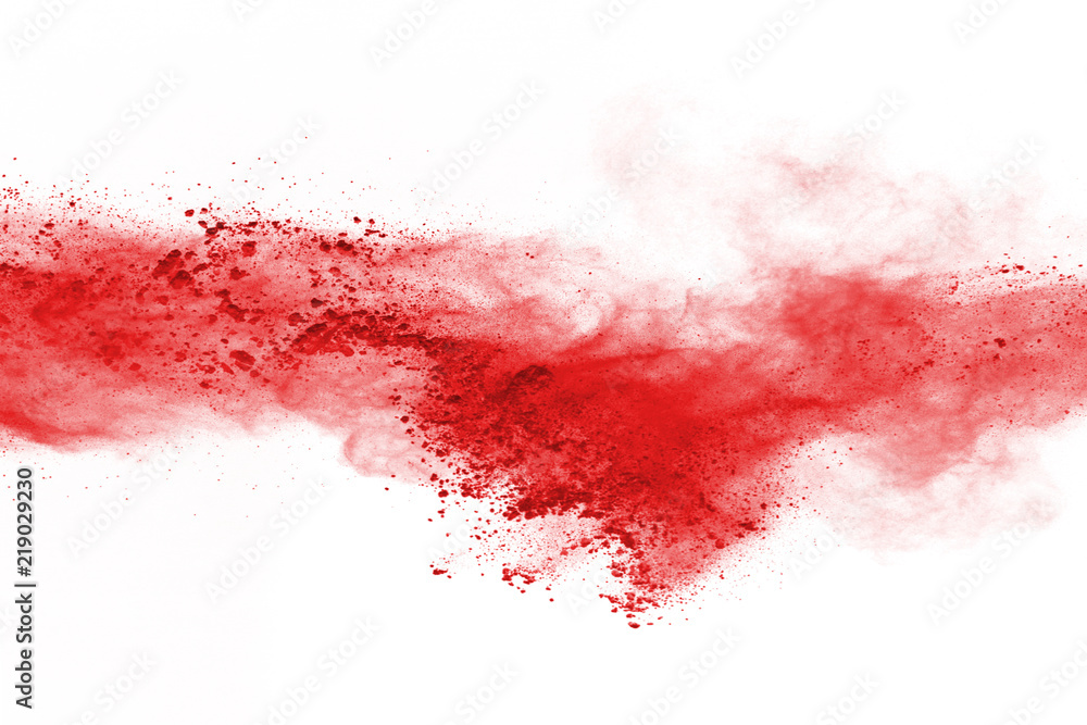 Wall mural freeze motion of red powder exploding, isolated on white background. abstract design of red dust clo