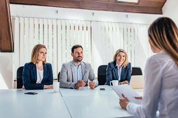 Woman having a job interview with HR specialists.
