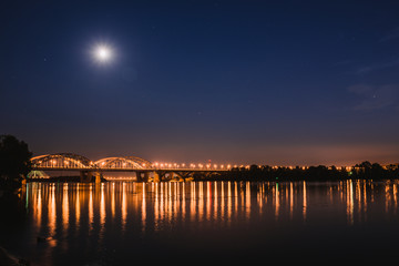 Fototapeta premium Darnitskiy bridge across Dnepr river at night. Kiev, Ukraine