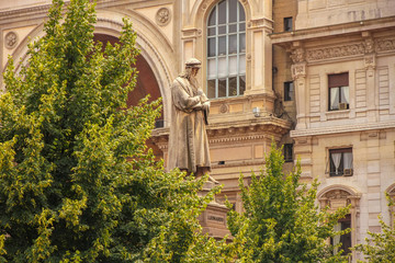 View on the statue of Leonardo da Vinci in Milan, Italy on a sunny day.