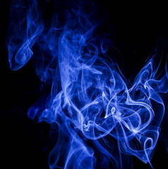 Blue smoke on black background