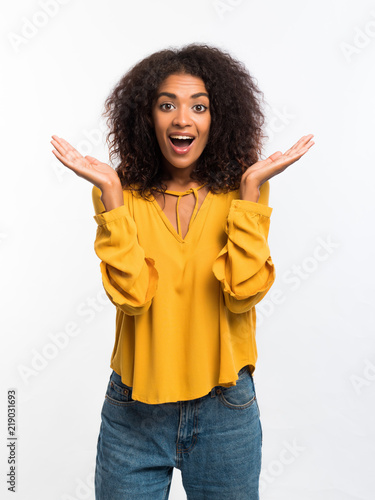 Beautiful African American Woman With Afro Hair In Yellow Wear