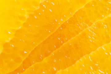 Flesh of juicy ripe orange as background or backdrop, close-up