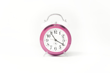soft pink clock isolated on white studio background. 