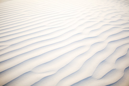 Waves on white sand background