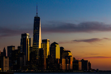 One World Trade Center and the surrounding buildings in Manhattan in New York City during the sunset