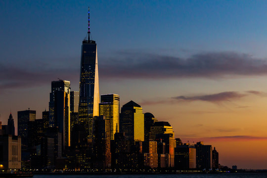 One World Trade Center and the surrounding buildings in Manhattan in New York City during the sunset
