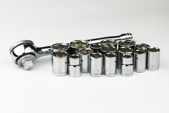 Set of shiny, chrome Metric and SAE sockets with ratchet