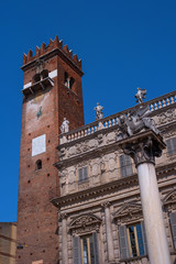 Verona, Italy - 06 May 2018: Verona historic city center - Palazzo Maffei palace and the Venecian Lion statue on the Piazza Erbe Square