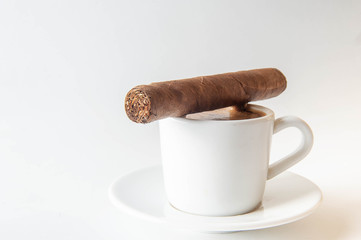 Cup and Turk coffee, cigar and guillotine isolated on white background.