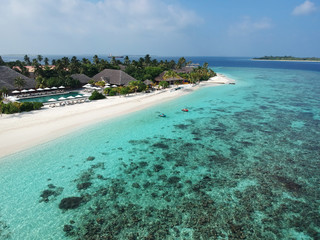 Drone aerial view set of a paradise island resort in maldives.