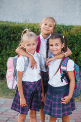 portrait of school kids with backpack after school. Beginning of lessons. First day of fall.