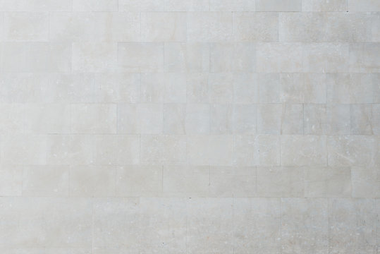 Fototapeta Old gray marble brick wall in Spain. Texture of marbles bricks