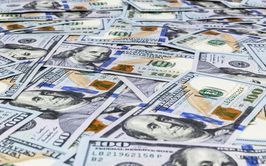 Stack of one hundred dollar bills. Stack of cash money in hundred dollar banknotes. Heap of hundred...
